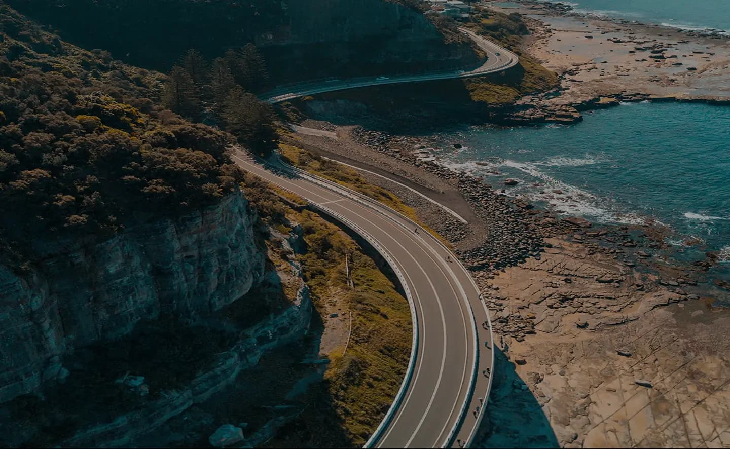 Coastal road above an Australian shoreline