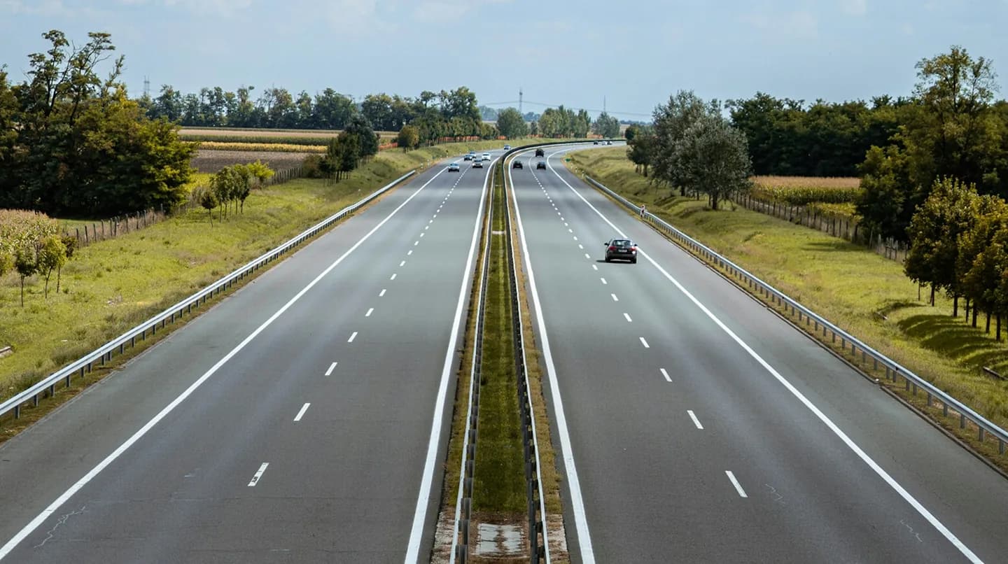 A highway running through green grassland