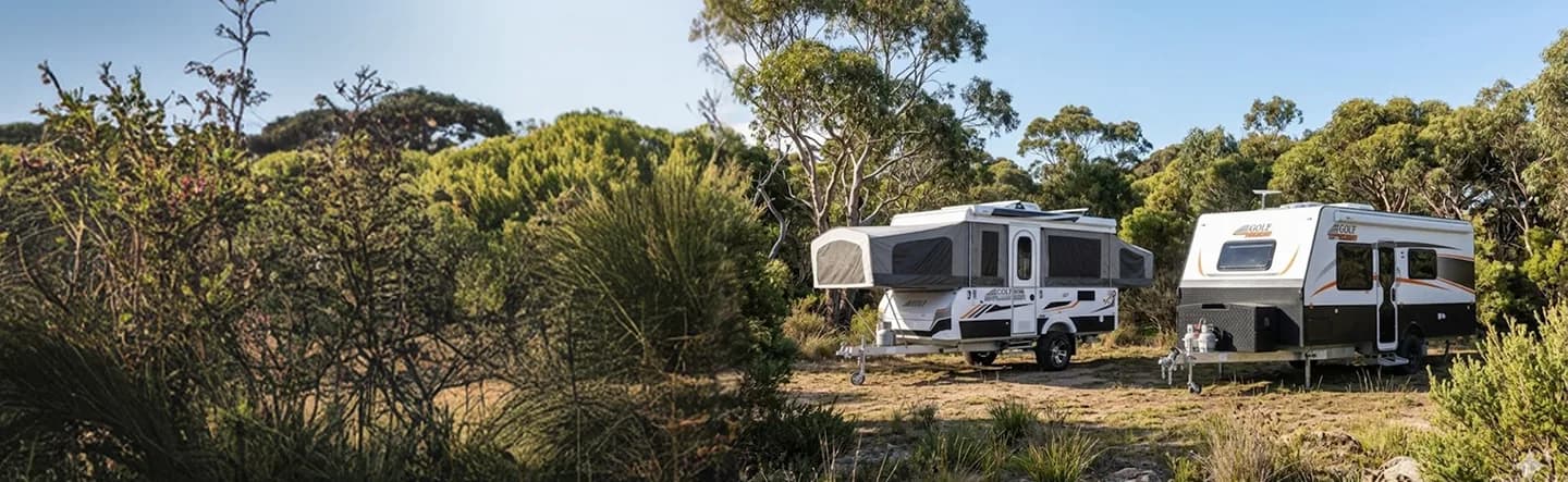Golf caravans set up in an Australian landscape